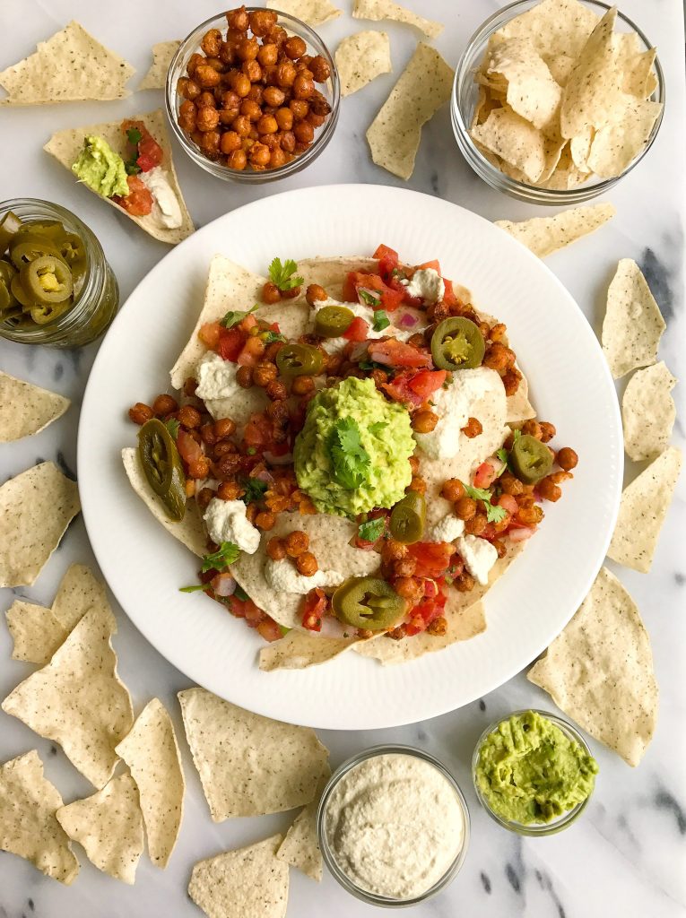 Vegan Buffalo Chickpea Nachos with Queso Sauce for a delicious plant-based nacho treat!