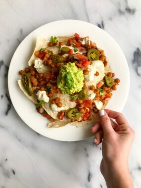 Vegan Buffalo Chickpea Nachos with Queso Sauce for a delicious plant-based nacho treat!