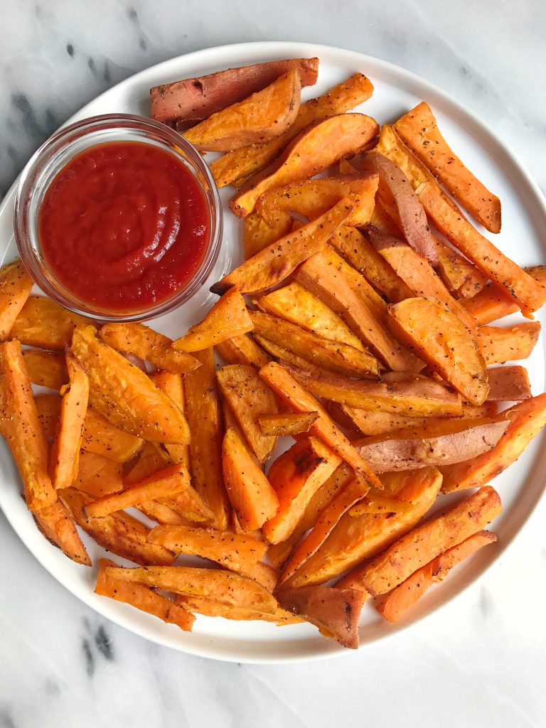Simple + Crispy Garlic Sweet Potato Fries for an easy and delicious vegan and gluten-free side!