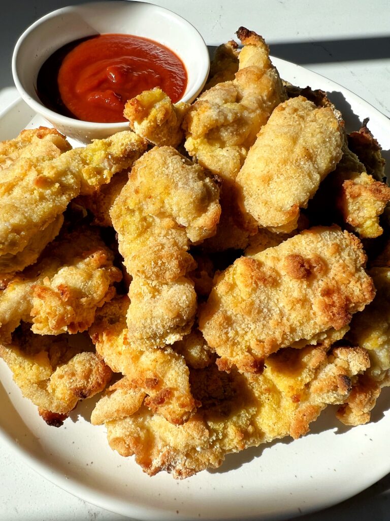 Paleo Chicken Nuggets that are crispy and quick and easy to make on the stovetop, oven or in your air fryer! Plus these are nut-free and gluten-free.