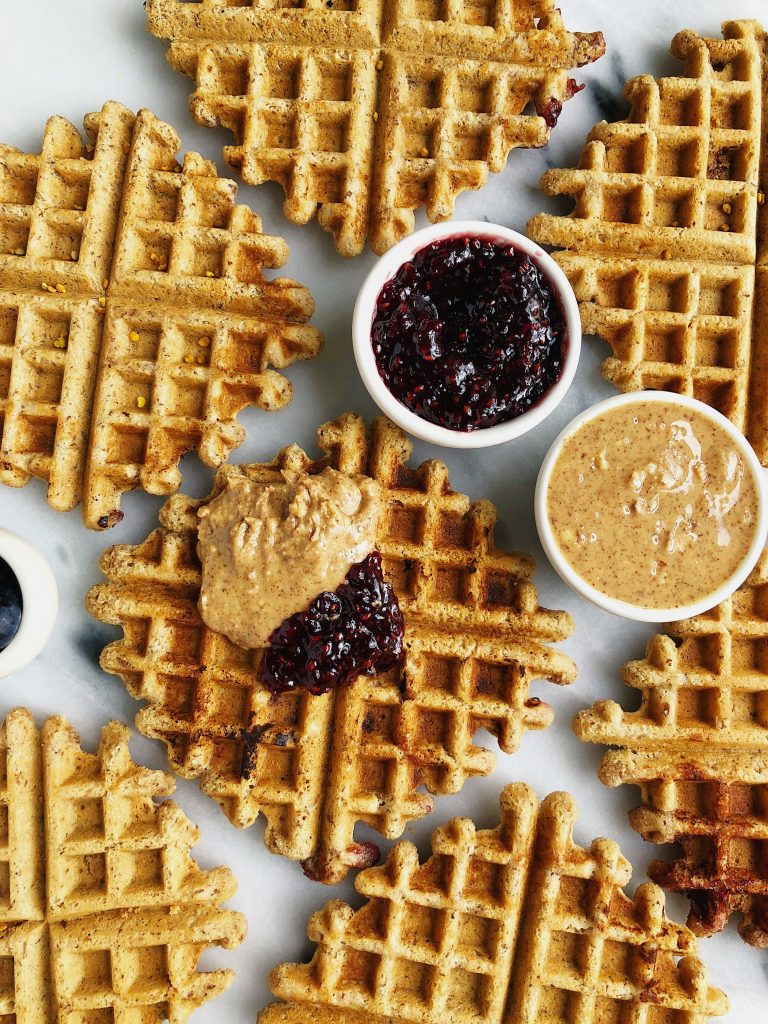 Crispy Peanut Butter & Jelly Stuffed Waffles made with vegan and gluten-free ingredients for a dreamy brunch recipe!