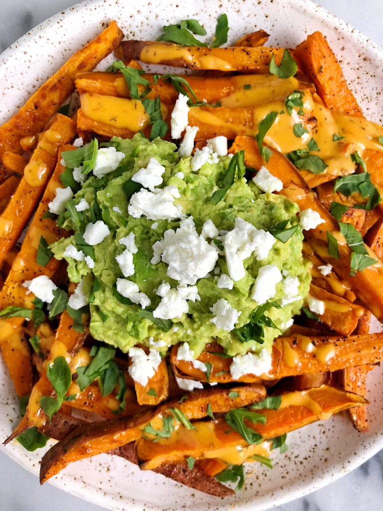 Loaded Guacamole Baked Sweet Potato Fries for a delicious and flavorful french fry recipe that is gluten-free and dairy-free!