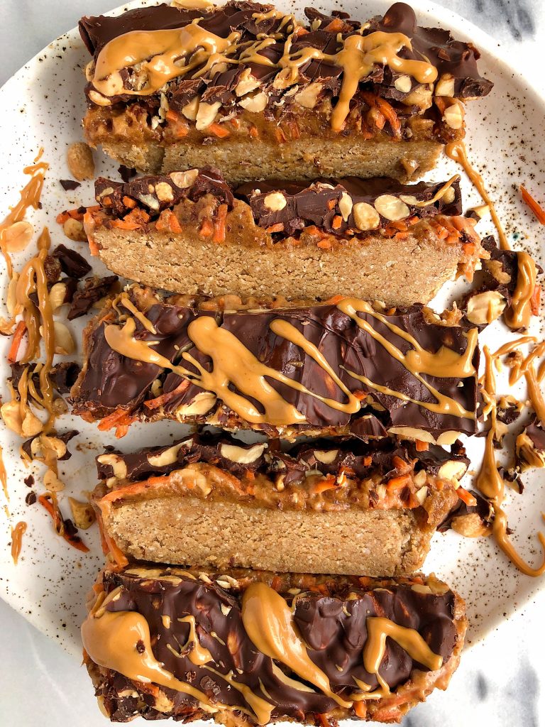 Raw Carrot Cake Candy Bars made with gluten-free and dairy-free ingredients for a healthier candy bar recipe with a peanut butter caramel and oatmeal cookie layer!