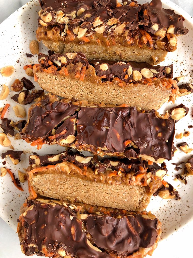 Raw Carrot Cake Candy Bars made with gluten-free and dairy-free ingredients for a healthier candy bar recipe with a peanut butter caramel and oatmeal cookie layer!