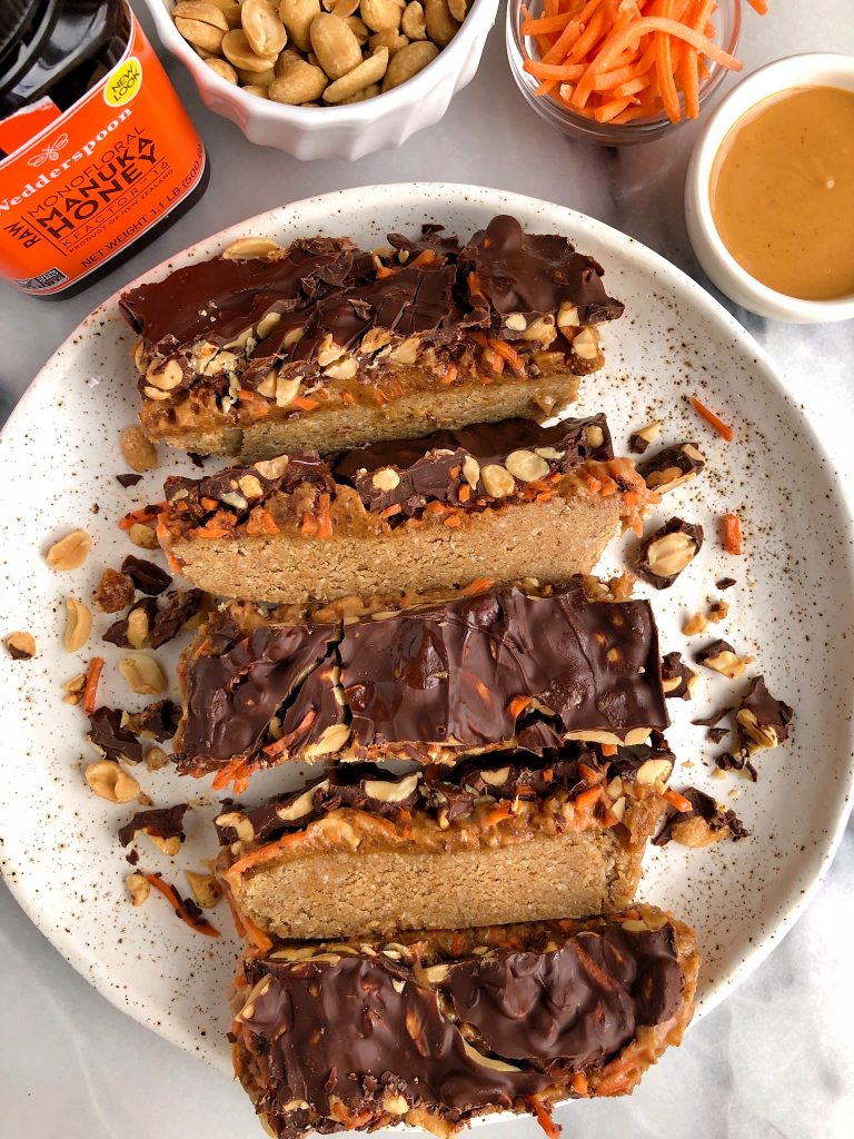 Raw Carrot Cake Candy Bars made with gluten-free and dairy-free ingredients for a healthier candy bar recipe with a peanut butter caramel and oatmeal cookie layer!