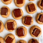 The Best Healthy Peanut Butter Blossoms made with vegan and gluten-free ingredients and topped with nut butter-filled dark chocolate!