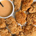 Healthier Paleo Crispy Chicken Tenders made with 3 key ingredients and paired with a homemade special sauce to dip!