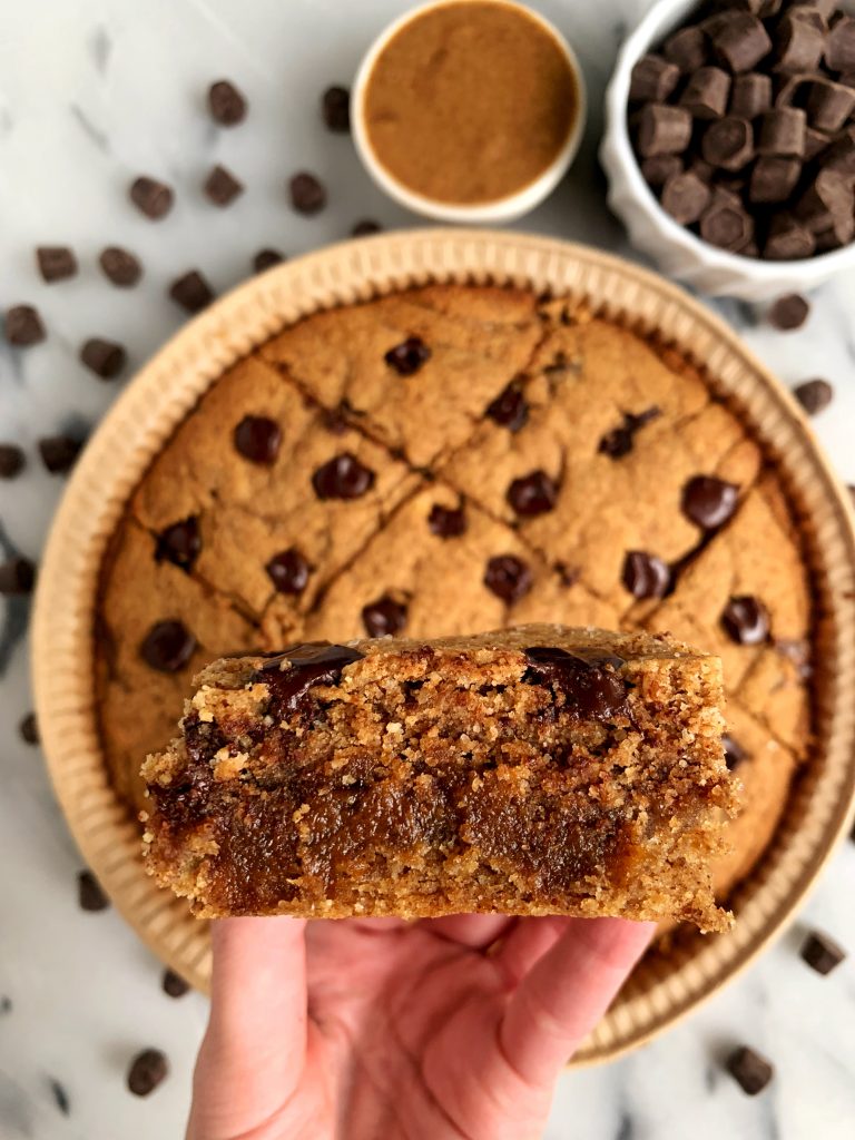 Paleo Salted Caramel Chocolate Chip Cookie Bars filled with a homemade 4 ingredient caramel and ready in under 30 minutes.
