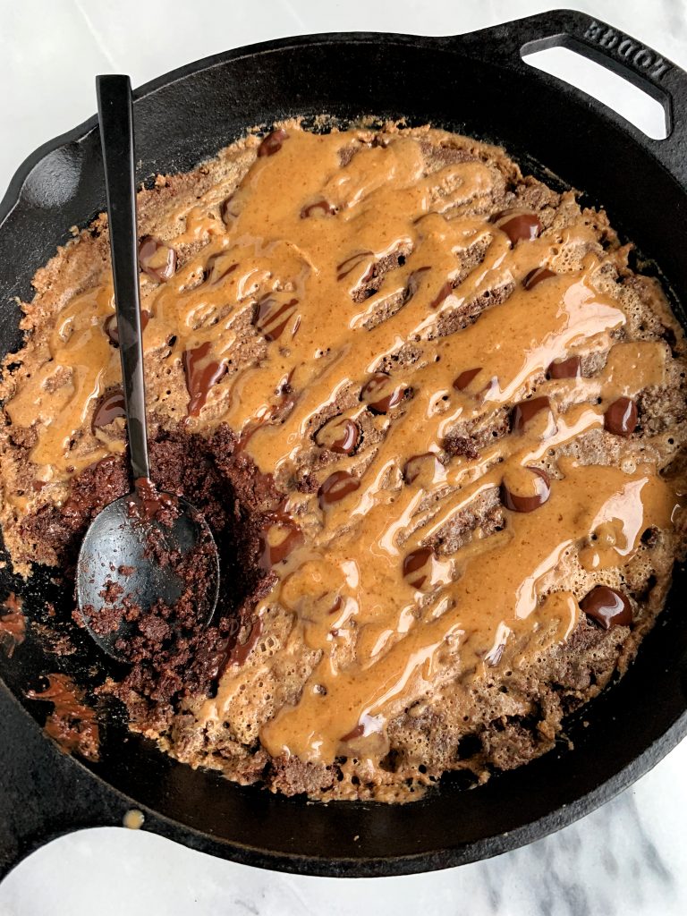 This Paleo Salted Caramel Brownie Skillet is the best most fudgey chocolatey brownie recipe ever. Plus it is lower in sugar and is made with all gluten-free, dairy-free and refined sugar-free ingredients. 