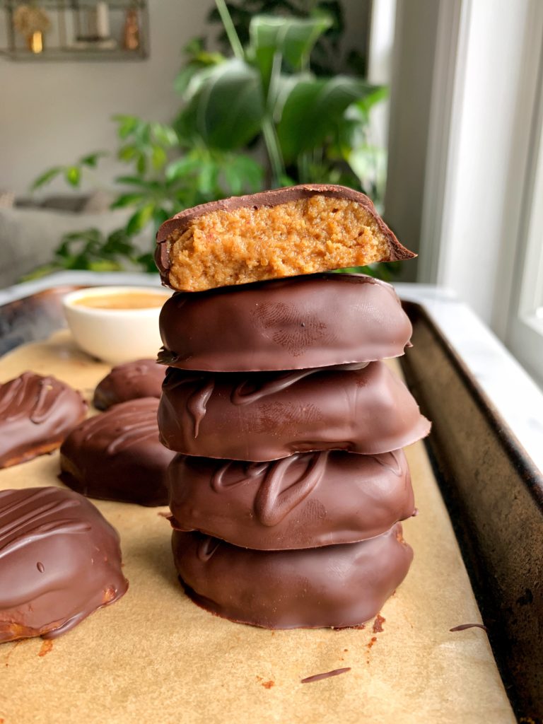 Healthier Copycat Reese's Eggs made with dates, creamy peanut butter, coconut flour and dark chocolate. A delicious homemade vegan and grain-free version of the classic.
