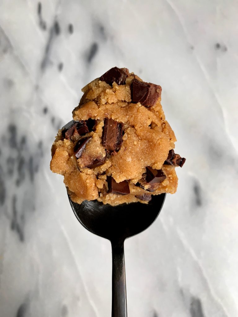 The BEST Edible Cookie Dough that is paleo, vegan-friendly and takes less than 5 minutes to whip up! A healthier cookie dough that is meant to be spooned and not baked.