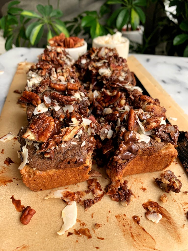 The Most Magical Magic Cookie Bars made with all vegan and paleo ingredients. A healthier twist on magic cookie bars with a doughy cookie base and pecan, chocolate and coconut topping!