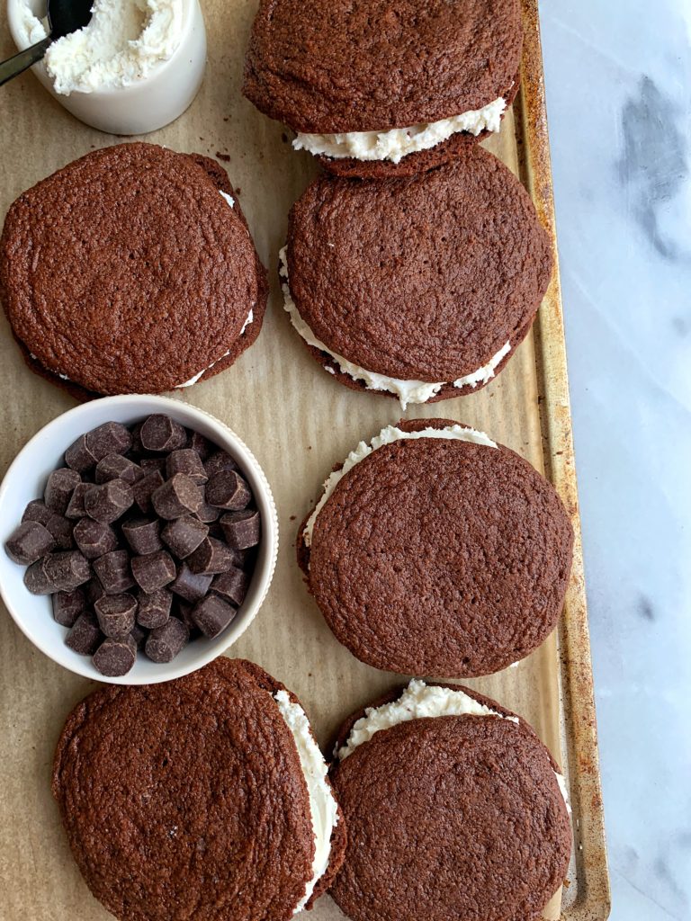 Rich gluten-free healthy Oreo Whoopie Pies made in one bowl and in under 30 minutes. These are insanely good and they happen to be dairy-free, gluten-free and filled with a delicious vanilla frosting in the center. Perfect easy dessert for kids and adults!
