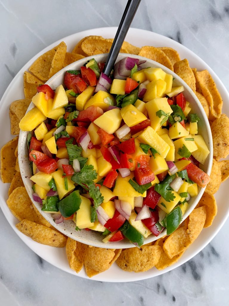 The Best Summery Mango Salsa made with all fresh and healthy ingredients like mango, red pepper and a little sweetness from organic manuka honey.