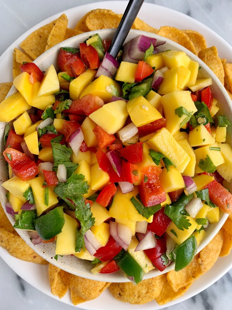 The Best Summery Mango Salsa made with all fresh and healthy ingredients like mango, red pepper and a little sweetness from organic manuka honey.