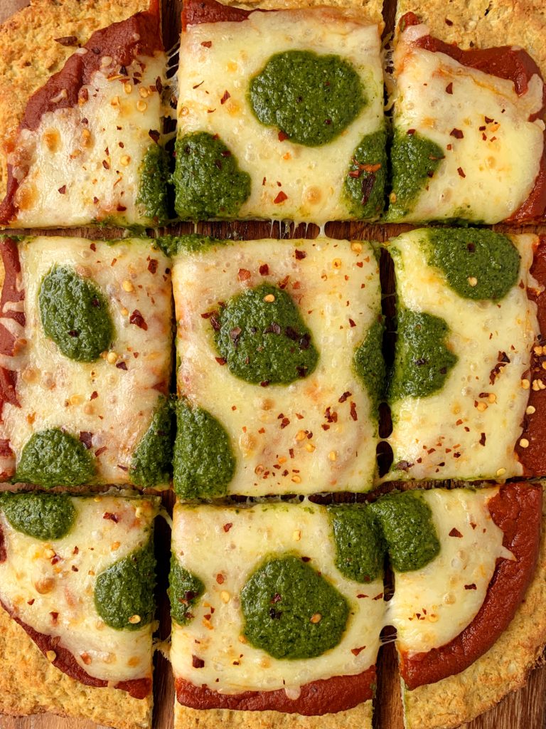 Sharing the BEST Cauliflower Pizza Crust ever! This recipe uses frozen cauliflower rice and it is also paleo, dairy-free and this cauliflower crust is extra crispy and doesn't fall apart.