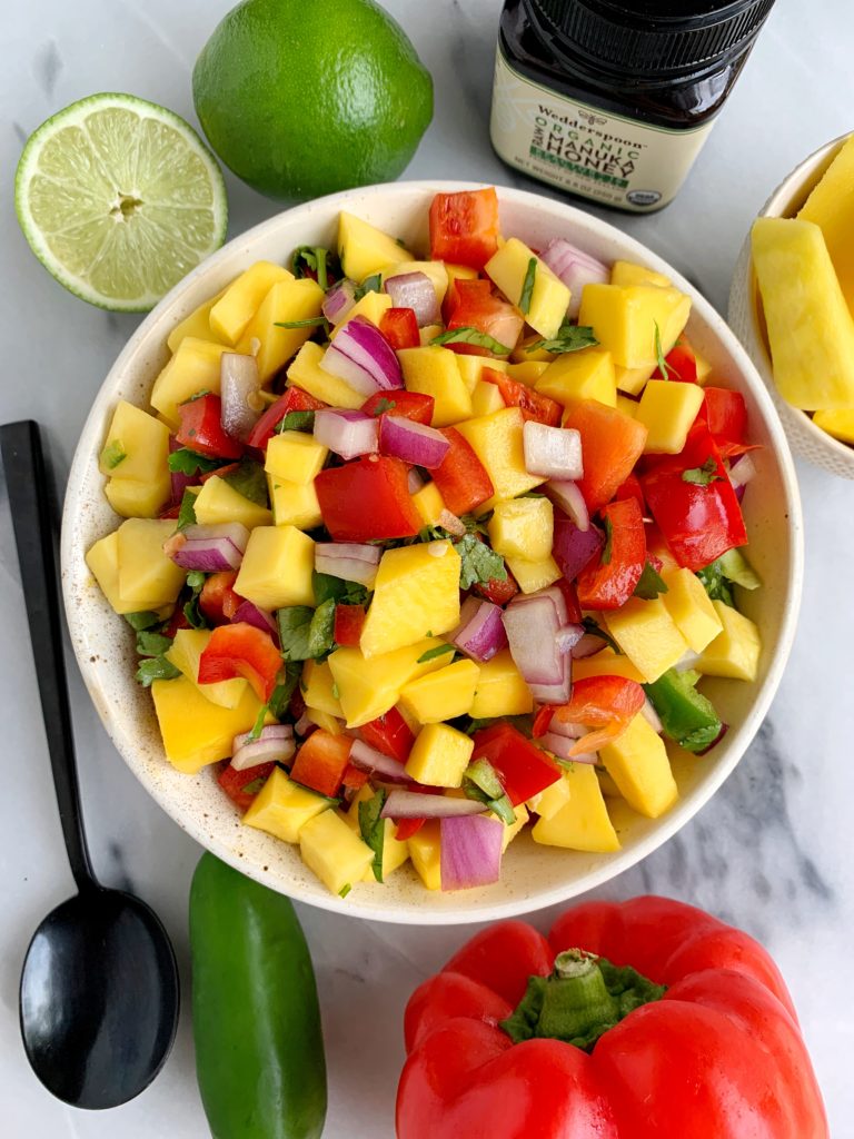 The Best Summery Mango Salsa made with all fresh and healthy ingredients like mango, red pepper and a little sweetness from organic manuka honey.