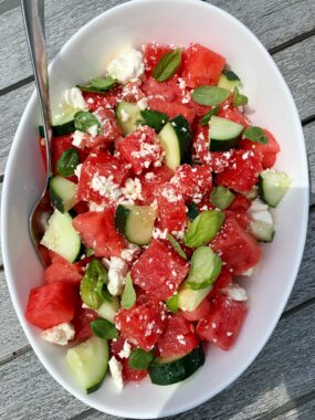 Sharing the most summery summertime salad: this Watermelon Salad with Feta, Cucumber + Basil. Take 5 minutes to prep and is incredibly refreshing, delicious and a healthy salad to serve all summer long.