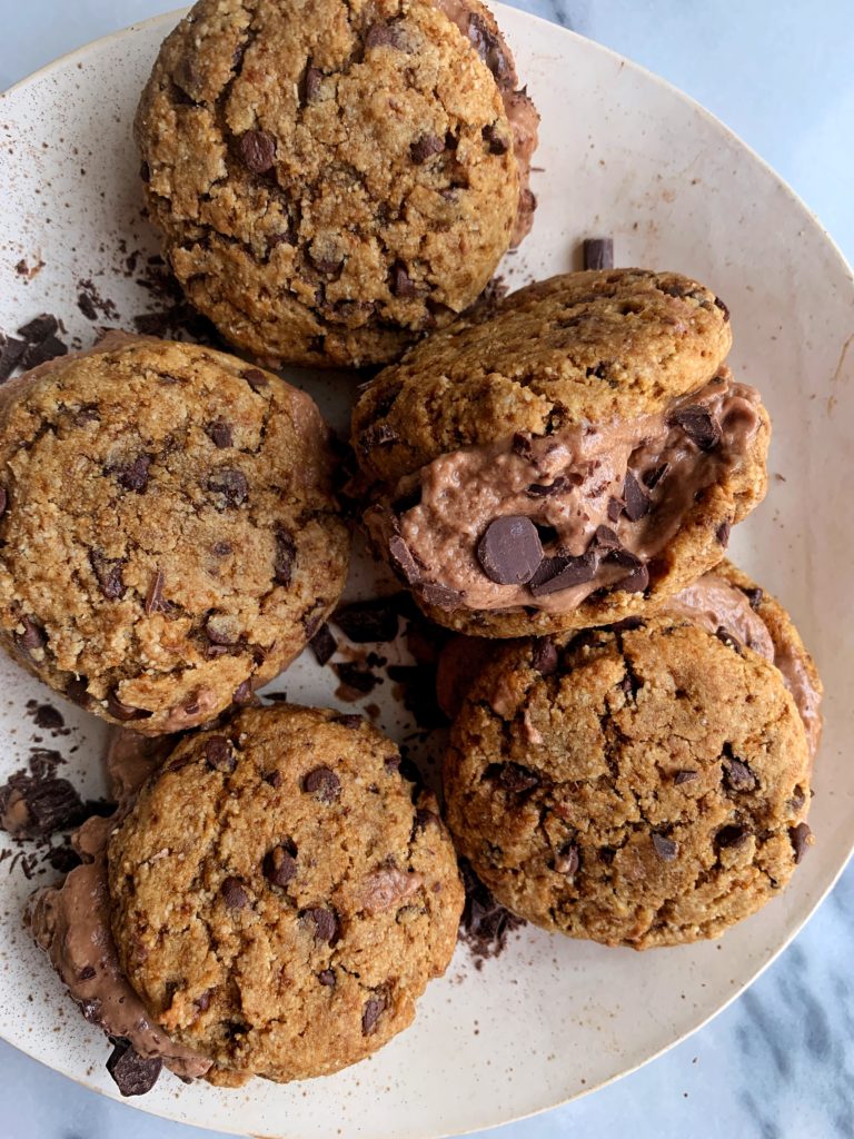 The Best Damn Chipwich Ice Cream Sandwiches using my favorite paleo and vegan almond flour chocolate chip cookie recipe and sandwiched between delicious chocolate fudge brownie almond milk ice cream. The best summertime dessert that truly tastes good all year around.
