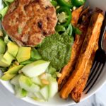 The juiciest healthy Avocado Chicken Burgers made with all paleo and whole30 ingredients. An easy and delicious chicken burger made on the stovetop (no grill needed) and paired with crispy sweet potato fries and topped with anything you are craving.