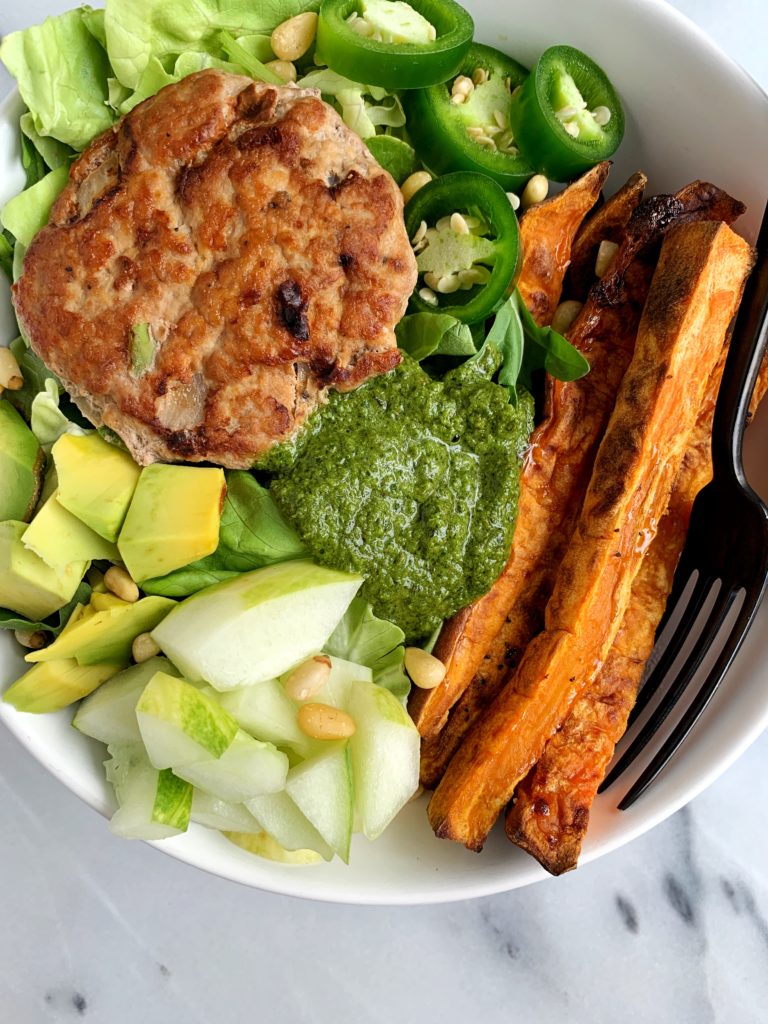 The juiciest healthy Avocado Chicken Burgers made with all paleo and whole30 ingredients. An easy and delicious chicken burger made on the stovetop (no grill needed) and paired with crispy sweet potato fries and topped with anything you are craving.