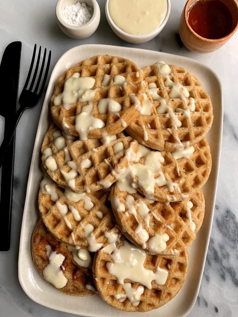 INSANE homemade Cinnamon Roll Pancakes with Cream Cheese Glaze. Made with all simple ingredients and truly the best homemade waffles that taste like a cinnamon bun glazed with cream cheese frosting.