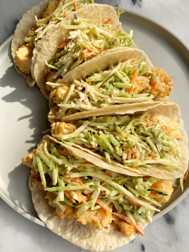 The Best Crispy Oven-Baked Paleo Fish Tacos made with all gluten-free ingredients and ready in less than 30 minutes start to finish. A family favorite over here that we all crave for dinner.