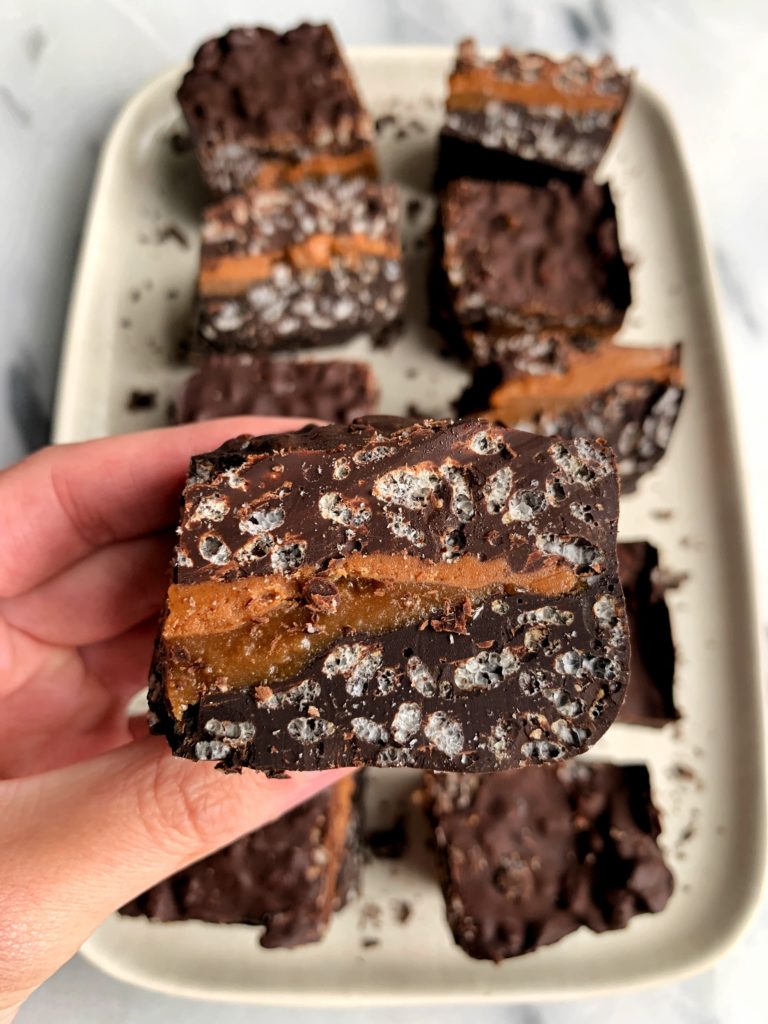 Healthier Vegan 100 Grand Bars made with all gluten-free and dairy-free ingredients. A dreamy crunchy dark chocolate filled with homemade caramel sauce in-between.