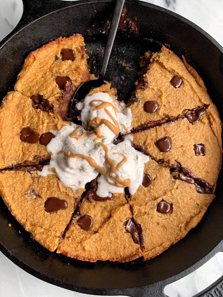 Sharing this doughy Paleo Chocolate Chip Pumpkin Cookie Skillet on the blog! A delicious giant gluten-free cookie recipe made with healthier ingredients and has the most perfect doughy cookie consistency.