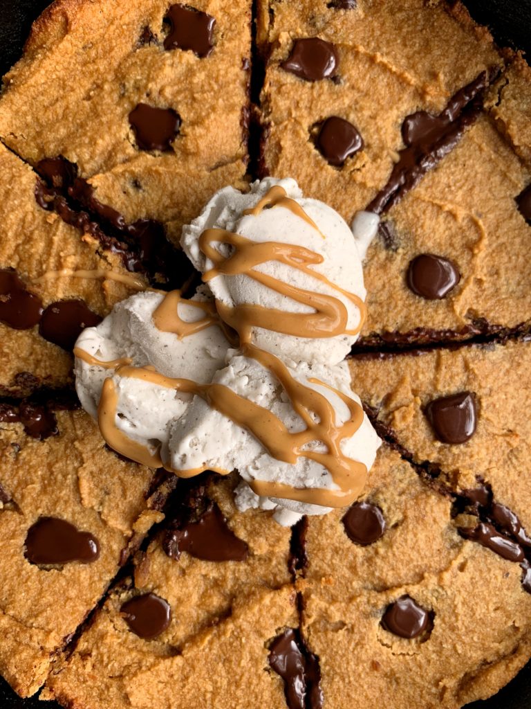 Sharing this doughy Paleo Chocolate Chip Pumpkin Cookie Skillet on the blog! A delicious giant gluten-free cookie recipe made with healthier ingredients and has the most perfect doughy cookie consistency.