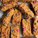 Healthier Gluten-free Monster Oatmeal Cookie Bars that taste like an oatmeal cookie dream! Filled with organic m&m candies and these oatmeal cookie bars are dairy-free, gluten-free and so delicious.