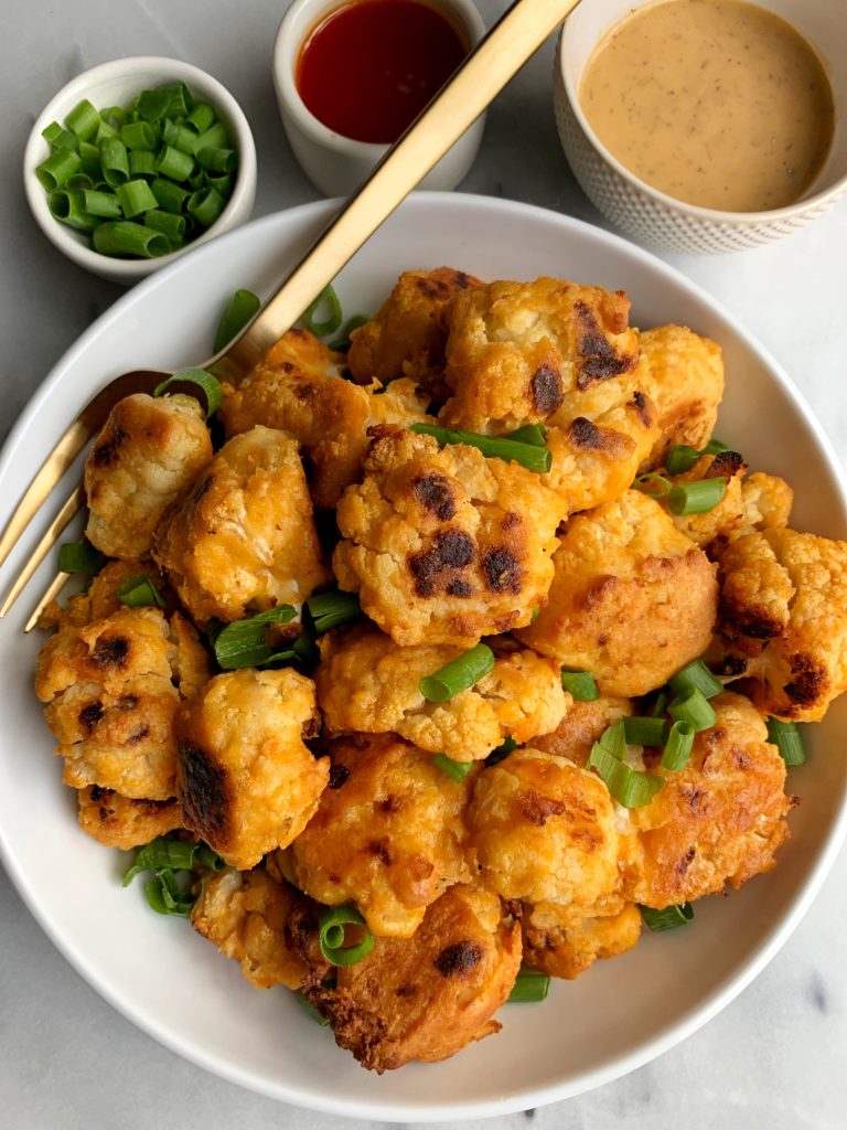 These extra crispy baked buffalo cauliflower wings are the ultimate veggie dish with a little kick! They are vegan, paleo and whole30 and they are so flavorful and simple to make!