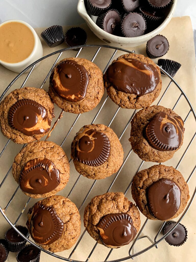 Gluten-free Peanut Butter Cup Blossoms that are truly the most delicious, soft-baked grain-free and vegan peanut butter cookie topped with dreamy dark chocolate peanut butter cups. 