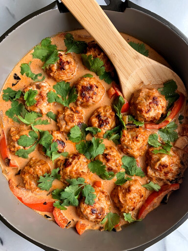 Healthy Thai Turkey Meatballs in Coconut Curry made with all gluten-free, dairy-free and paleo ingredients. This recipe is packed with flavor and can be served over your favorite rice, noodles, zucchini noodles, anything you want!