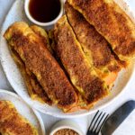 The BEST Cinnamon Sugar Challah French Toast Sticks! These are the ultimate breakfast or brunch recipe to make when you are craving french toast and they are made in the oven.
