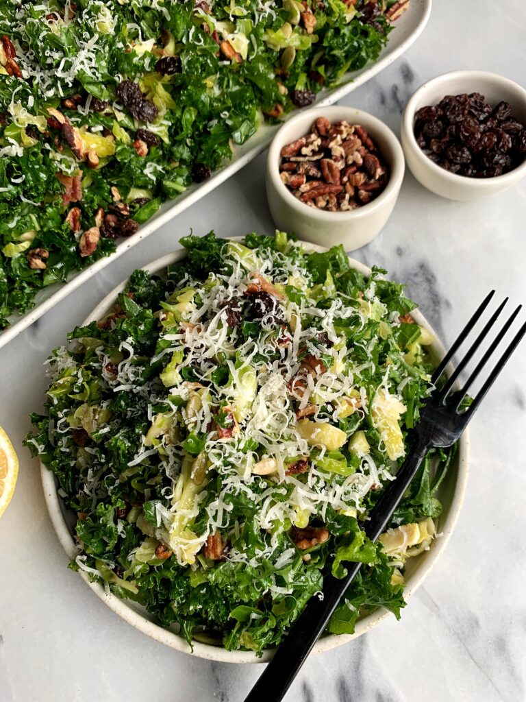 Healthy and delicious Kale + Brussels Sprout Slaw with a homemade Honey Mustard Dressing. One of my favorite quick and easy salads to whip up and it is made with all gluten-free ingredients. 