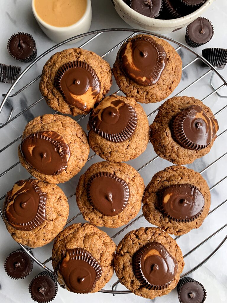 Gluten-free Peanut Butter Cup Blossoms that are truly the most delicious, soft-baked grain-free and vegan peanut butter cookie topped with dreamy dark chocolate peanut butter cups. 