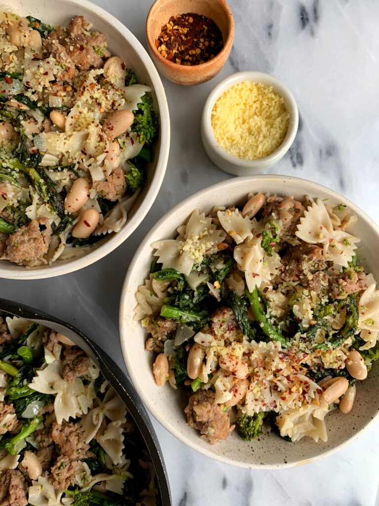 This delicious Gluten-free Broccoli Rabe + Sausage Pasta is one of our family favorite dinner recipes. It is easy to prepare and a healthier version of the classic pasta dish and it is so flavorful. 