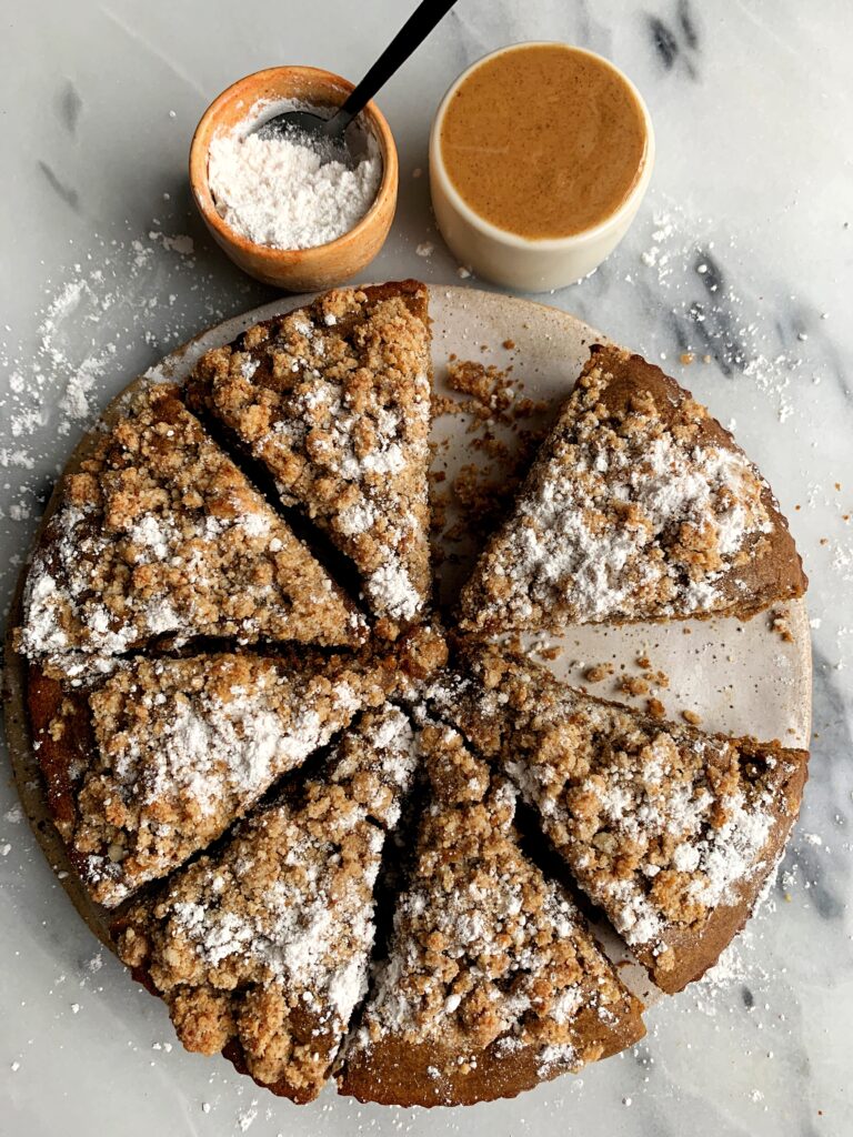 The most delicious Paleo Gingerbread Coffee Cake made with a dreamy gingerbread cake base and topped with a paleo crumb cake topping.