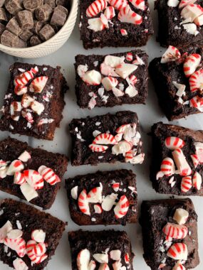 The best ever Paleo Peppermint Brownies with a homemade chocolate frosting on top! These are the ultimate holiday brownie recipe and they also happen to be gluten-free, nut-free and hands down better than any boxed brownie mix.
