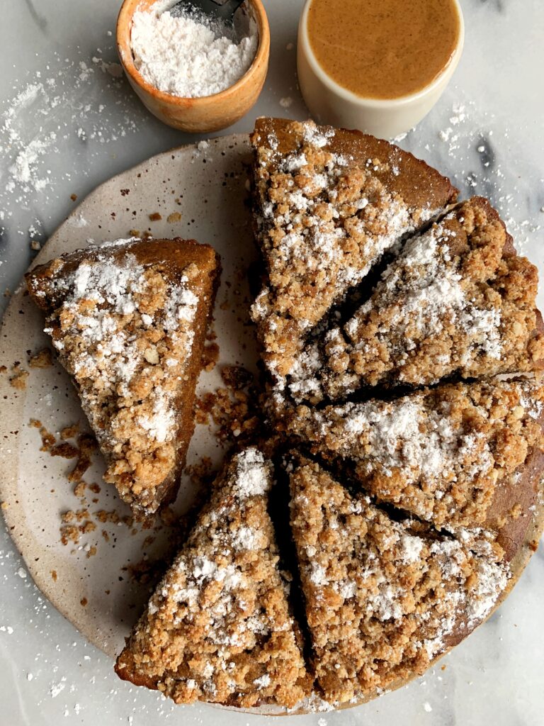 The most delicious Paleo Gingerbread Coffee Cake made with a dreamy gingerbread cake base and topped with a paleo crumb cake topping.