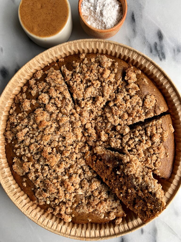 The most delicious Paleo Gingerbread Coffee Cake made with a dreamy gingerbread cake base and topped with a paleo crumb cake topping.