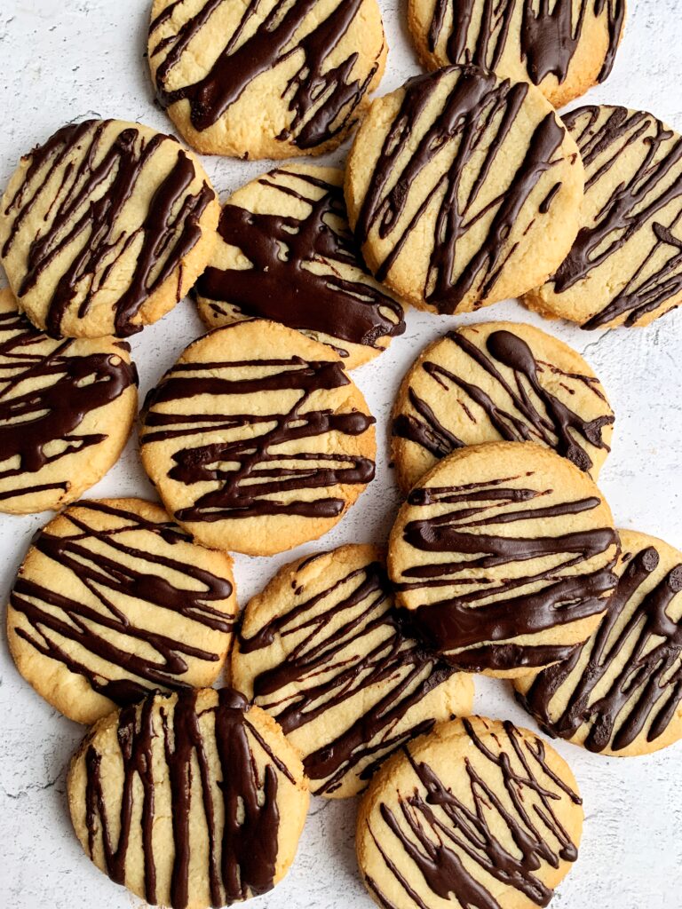 The Easiest Gluten-free Shortbread Cookies made with 3 key ingredients and drizzled with some dark chocolate on top. Such a delicious and simple cookie recipe to make.