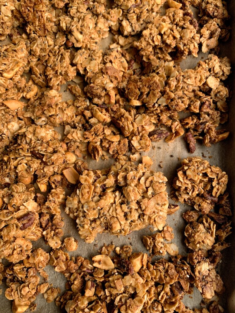 Addicting Gluten-free Cinnamon Peanut Butter Granola with big CLUSTERS! This vegan granola recipe is absolutely delicious and so easy to make.