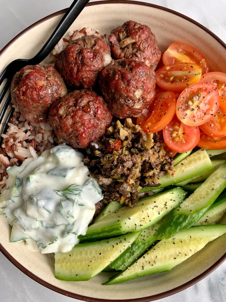 Sharing one of our favorite easy dinners, 30-minute Healthy Greek Meatballs with Tzatziki Sauce! The easiest oven-baked paleo meatballs.