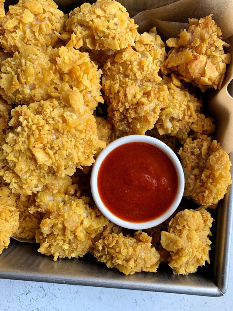 Extra Crispy Gluten-free Popcorn Chicken that is oven-baked and easy to make. A family favorite made with healthier ingredients!