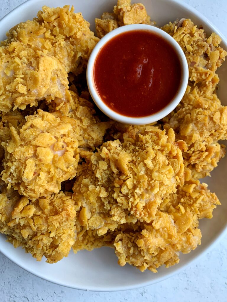 Extra Crispy Gluten-free Popcorn Chicken that is oven-baked and easy to make. A family favorite made with healthier ingredients!