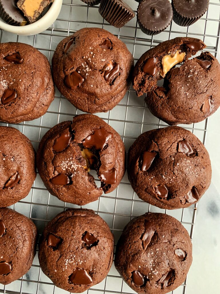 Life changing gluten-free Peanut Butter Cup Stuffed Brownie Cookies that are actually out of this world. Easy to make and each stuffed with a dark chocolate peanut butter cup.