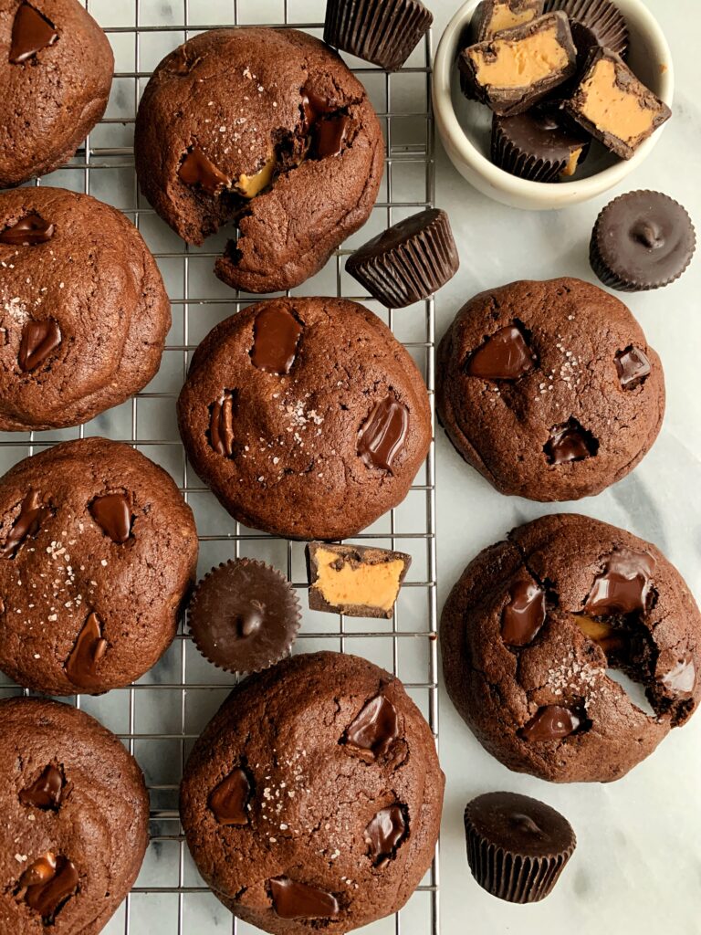 Life changing gluten-free Peanut Butter Cup Stuffed Brownie Cookies that are actually out of this world. Easy to make and each stuffed with a dark chocolate peanut butter cup.