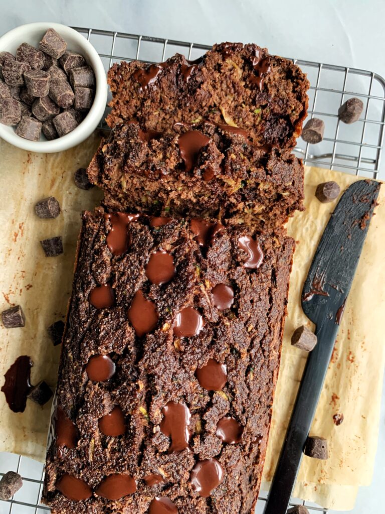 Delicious Paleo Chocolate Zucchini Bread made with all gluten-free and diary-free ingredients! An easy and healthy zucchini bread recipe with a chocolatey twist and lower in sugar.